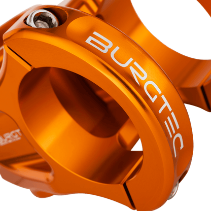 BURGTEC ENDURO MK3 stem in orange — handlebar clamp detail