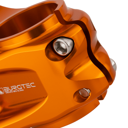 BURGTEC ENDURO MK3 stem in orange — steerer clamp detail